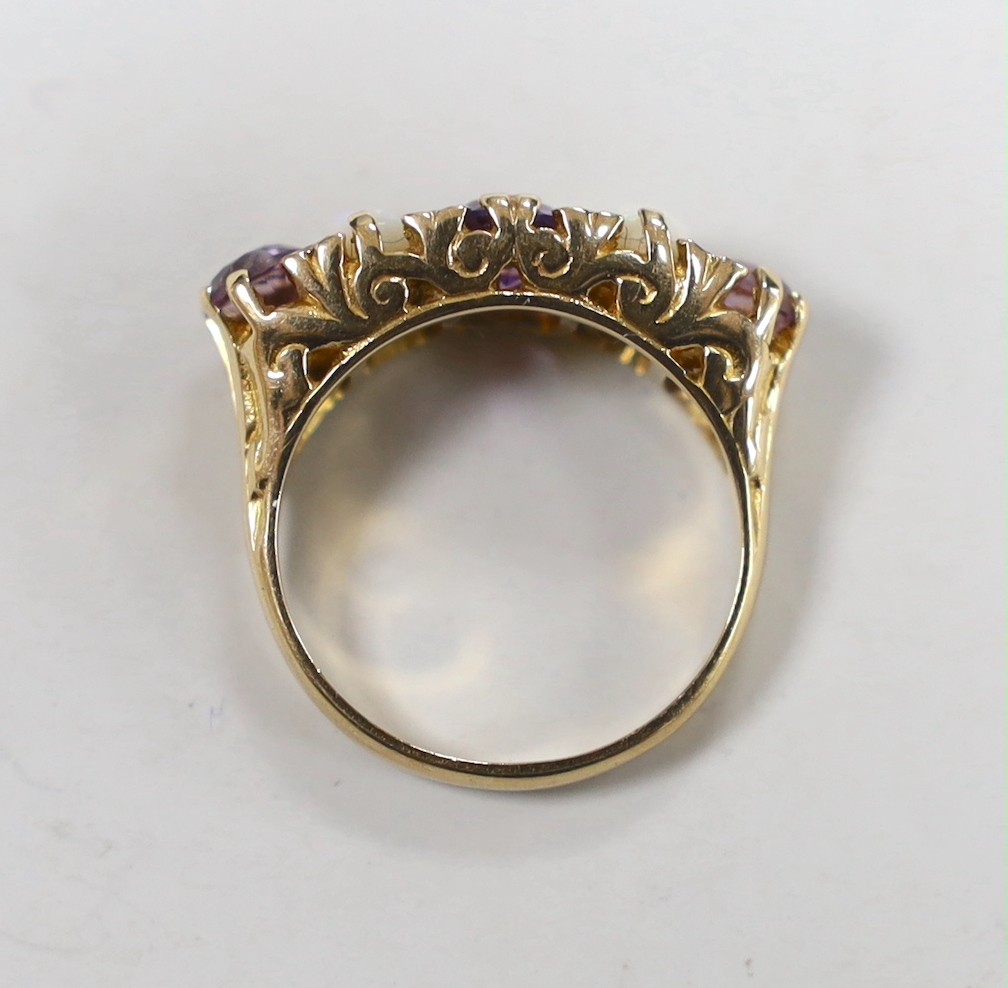 A modern 9ct gold, three stone amethyst and two stone white opal set half hoop ring, with white stone chip spacers, size L/M, gross weight 5 grams.